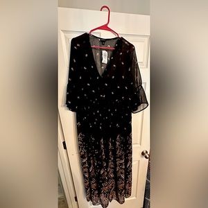 Torrid quart length Black Floral Dress with tags still on. Size 0x